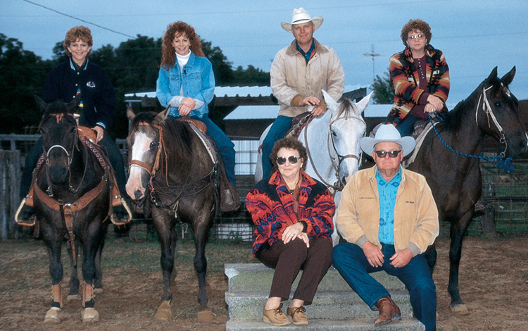 Reba and family on horseback 